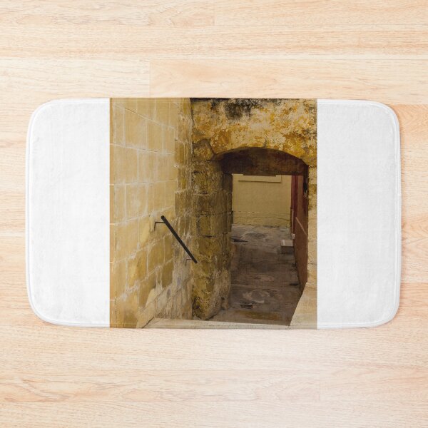 Item preview, Old Stone Archway Over Narrow Sunlit Alleyway in Historic European Passage designed and sold by Nmallia.