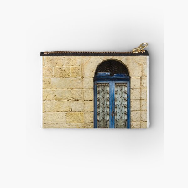 Item preview, Blue Arched Window With Intricate Iron Grille Set in Cream Stone Wall Facade designed and sold by Nmallia.