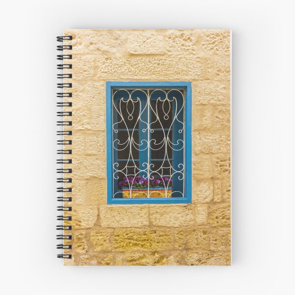 Item preview, Bright Blue Window With Ornate White Grilles And Colorful Flower Box On Yellow Stone Wall designed and sold by Nmallia.