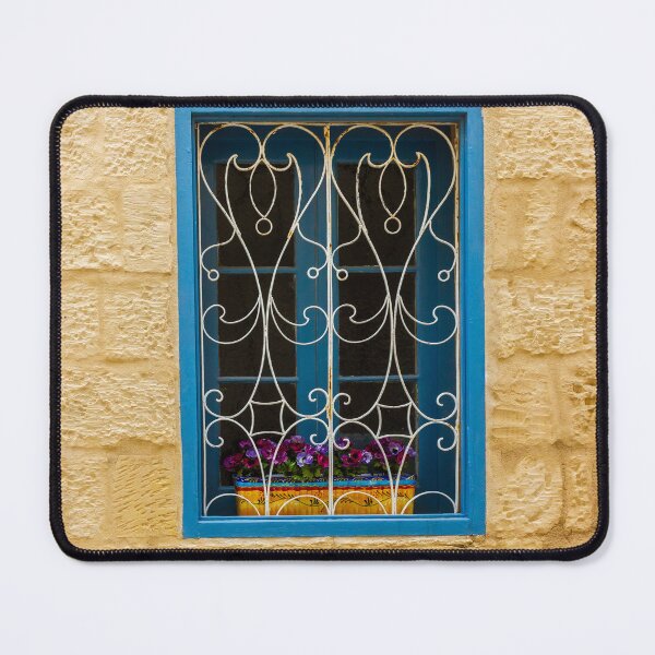 Item preview, Bright Blue Window With Ornate White Grilles And Colorful Flower Box On Yellow Stone Wall designed and sold by Nmallia.