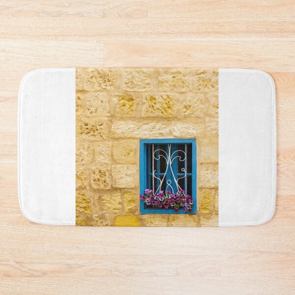 Item preview, Bright Blue Window With Ornate White Grilles And Colorful Flower Box On Yellow Stone Wall designed and sold by Nmallia.