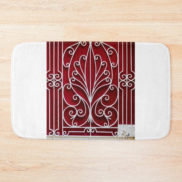 Item preview, Ornate White Iron Gate With Curved Scrollwork Against Deep Red Background Architectural Facade Decor Art designed and sold by Nmallia.