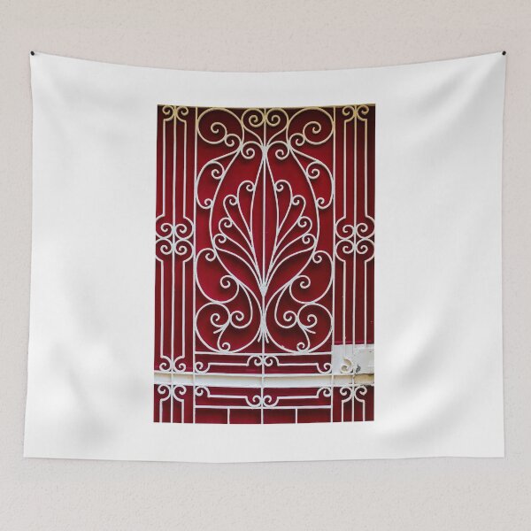 Item preview, Ornate White Iron Gate With Curved Scrollwork Against Deep Red Background Architectural Facade Decor Art designed and sold by Nmallia.