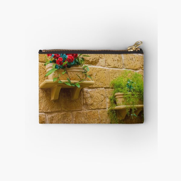 Item preview, Rustic Wall Planters With Red Geraniums And Green Trailing Plants On Stone Wall designed and sold by Nmallia.