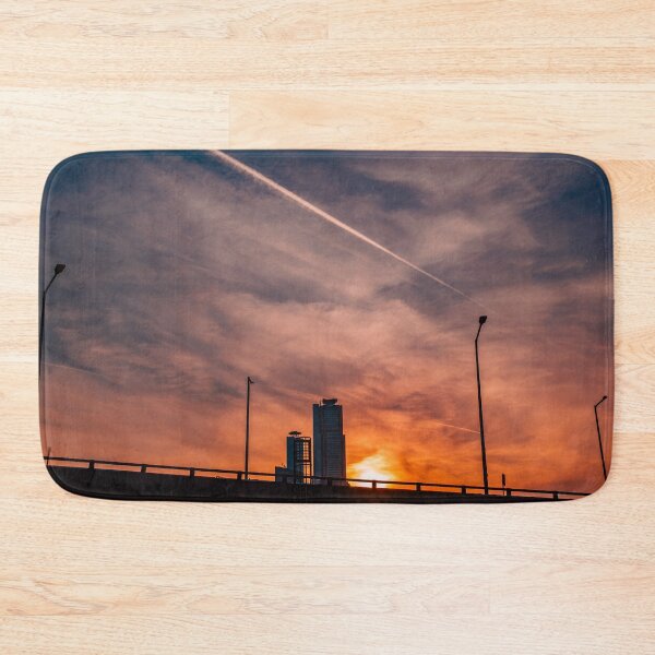 Item preview, Contrail Across Glowing Sunset Sky Above Bridge designed and sold by Nightwindow.