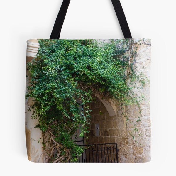 Item preview, Green Vines Over Stone Archway and Wrought Iron Gate in Historic Narrow Alleyway designed and sold by Nmallia.