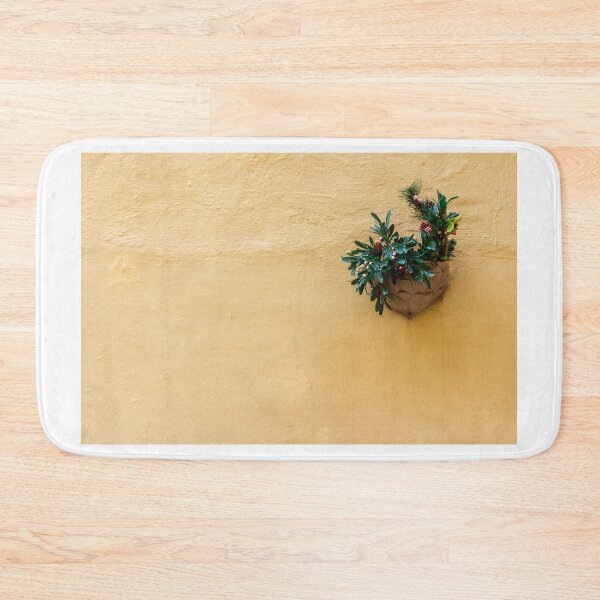 Item preview, Vibrant Green Plant in a Decorative Pot on a Bright Yellow Wall designed and sold by Nmallia.