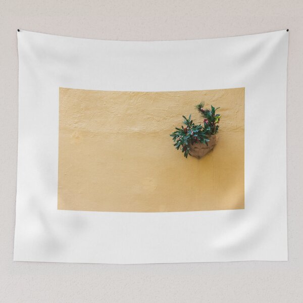 Item preview, Vibrant Green Plant in a Decorative Pot on a Bright Yellow Wall designed and sold by Nmallia.