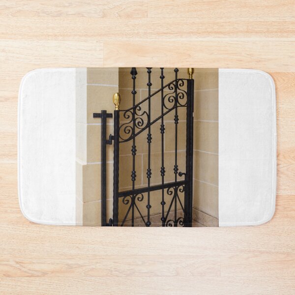 Item preview, Elegant Black Wrought Iron Gate With Gold Finials Set Against Beige Stone Wall designed and sold by Nmallia.