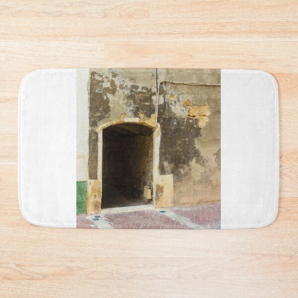 Item preview, Weathered City Wall With Arched Doorway Leading to Dark Tunnel on Worn Facade designed and sold by Nmallia.