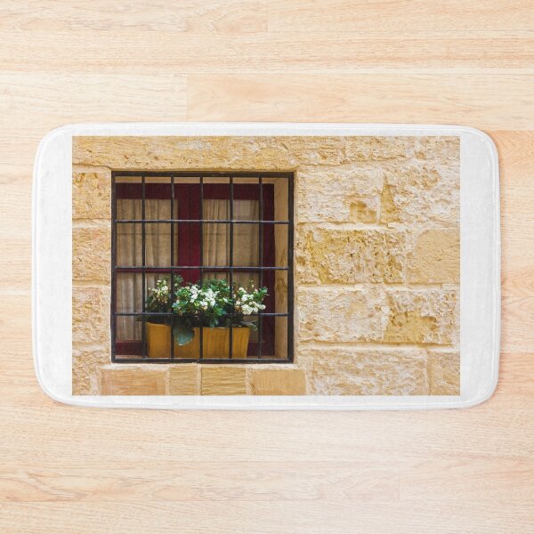 Item preview, Window With Barred Window Box Of White Flowers In A Yellow Stone Wall designed and sold by Nmallia.