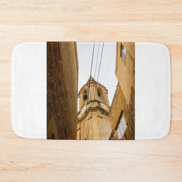 Item preview, Historic Clock Tower In Malta: Golden Stone Facade, Tall Bell Tower With Weathered Exterior designed and sold by Nmallia.
