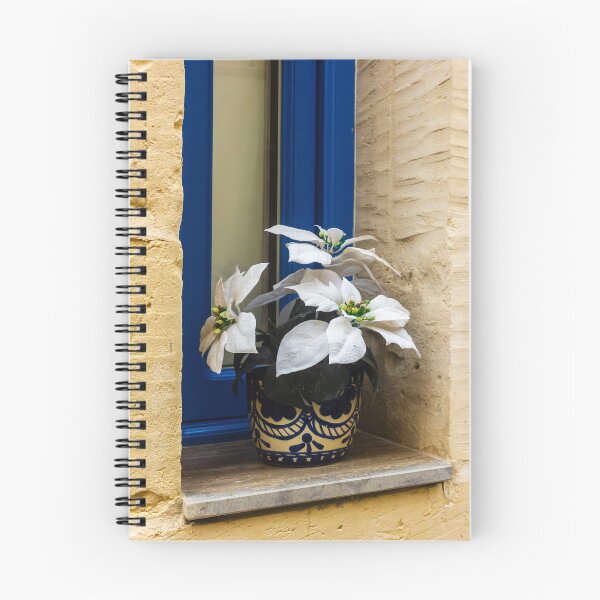 Item preview, Decorative White Plant in Blue Ceramic Pot on Window Sill Against Yellow Brick Wall Facade designed and sold by Nmallia.