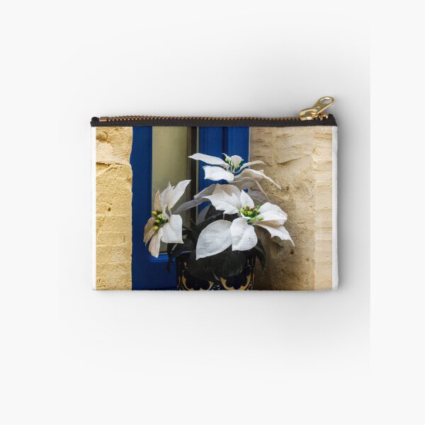 Item preview, Decorative White Plant in Blue Ceramic Pot on Window Sill Against Yellow Brick Wall Facade designed and sold by Nmallia.