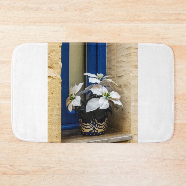 Item preview, Decorative White Plant in Blue Ceramic Pot on Window Sill Against Yellow Brick Wall Facade designed and sold by Nmallia.