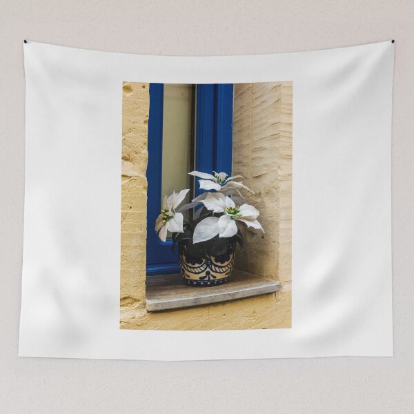 Item preview, Decorative White Plant in Blue Ceramic Pot on Window Sill Against Yellow Brick Wall Facade designed and sold by Nmallia.