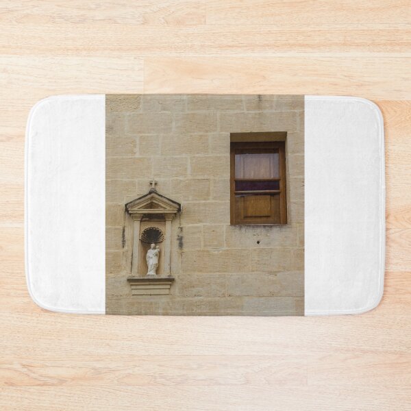 Item preview, Stone Wall With Niche Statue And Wooden Window On Historic Beige Exterior designed and sold by Nmallia.