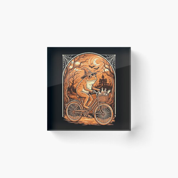 Item preview, Witch Frog Riding a Bicycle Through a Spooky Halloween Night designed and sold by MiALopezArt.