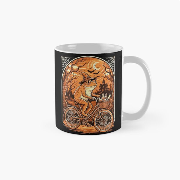 Item preview, Witch Frog Riding a Bicycle Through a Spooky Halloween Night designed and sold by MiALopezArt.