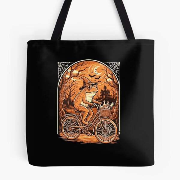 Item preview, Witch Frog Riding a Bicycle Through a Spooky Halloween Night designed and sold by MiALopezArt.