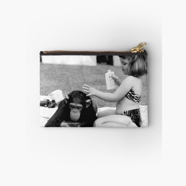 Item preview, Unlikely best friends, little girl putting suntan lotion on baby chimpanzee funny humorous vintage black and white photograph designed and sold by Astrid Arkhangelsky.