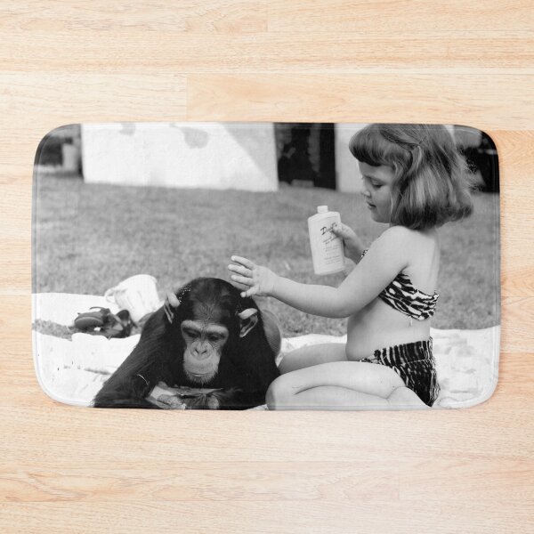 Item preview, Unlikely best friends, little girl putting suntan lotion on baby chimpanzee funny humorous vintage black and white photograph designed and sold by Astrid Arkhangelsky.