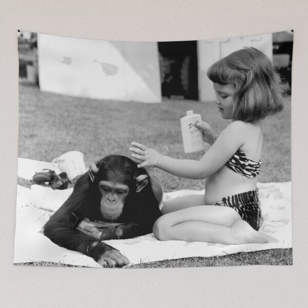 Item preview, Unlikely best friends, little girl putting suntan lotion on baby chimpanzee funny humorous vintage black and white photograph designed and sold by Astrid Arkhangelsky.