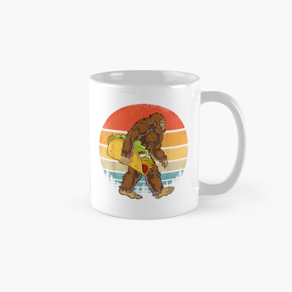 Item preview, Bigfoot Carrying Taco Funny Cinco de Mayo Boys Men Sasquatch T-Shirt designed and sold by Julian Segers.