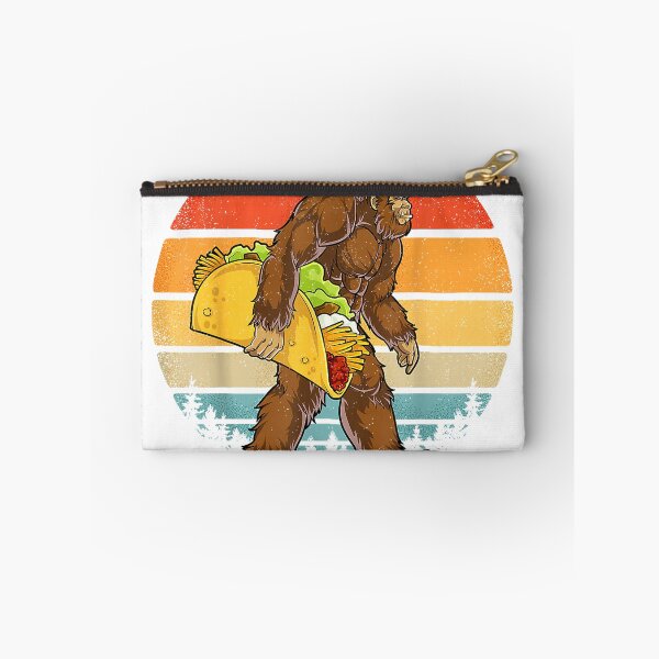Item preview, Bigfoot Carrying Taco Funny Cinco de Mayo Boys Men Sasquatch T-Shirt designed and sold by Julian Segers.