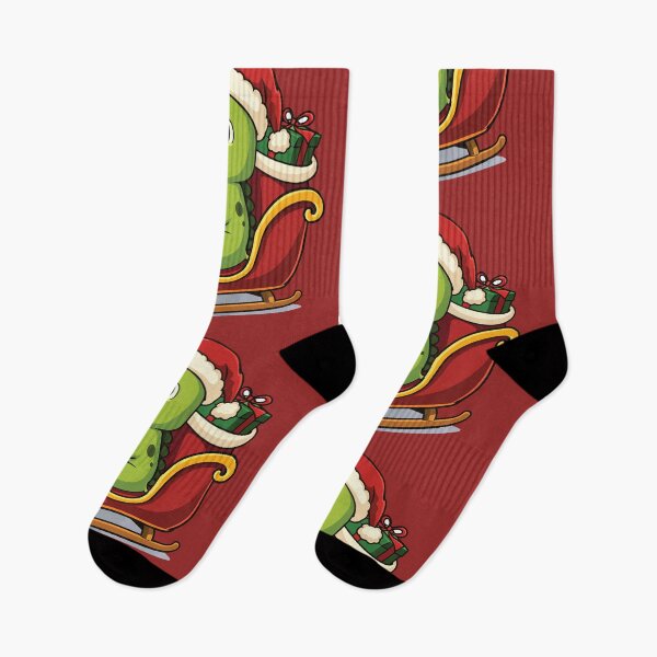Item preview, Cute cartoon illustration of a dinosaur riding a red Christmas sled designed and sold by merona-design.