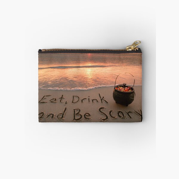 Item preview, Eat Drink And Be Scary Sand Inscription With Candy Cauldron At Sunset Shoreline designed and sold by chase-thewave.