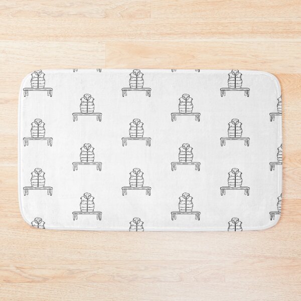 Item preview, doodle illustration of a puffer vest neatly folded on a bench designed and sold by rasagamastore.