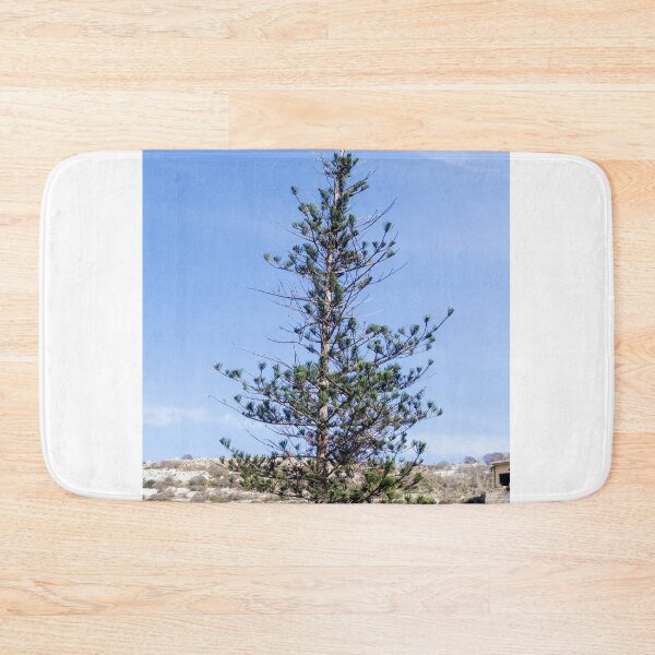 Item preview, Solitary Pine Tree Against Clear Blue Sky Over Rocky Mediterranean Hillside Landscape designed and sold by Nmallia.