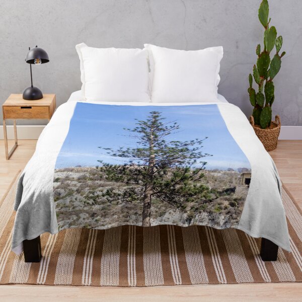 Item preview, Solitary Pine Tree Against Clear Blue Sky Over Rocky Mediterranean Hillside Landscape designed and sold by Nmallia.