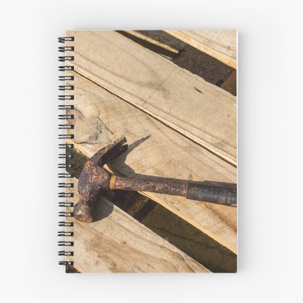 Item preview, Rusty Claw Hammer Lying On Wooden Pallet With Weathered Handle And Sunlit Texture designed and sold by Nmallia.