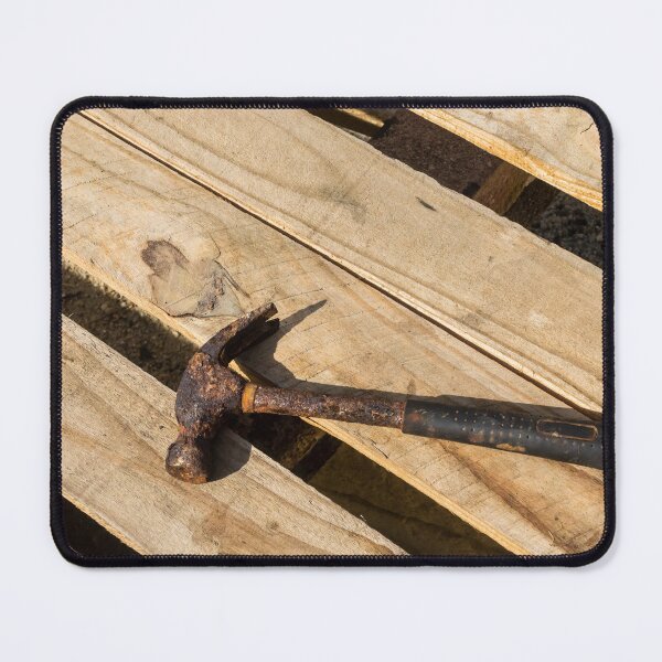 Item preview, Rusty Claw Hammer Lying On Wooden Pallet With Weathered Handle And Sunlit Texture designed and sold by Nmallia.