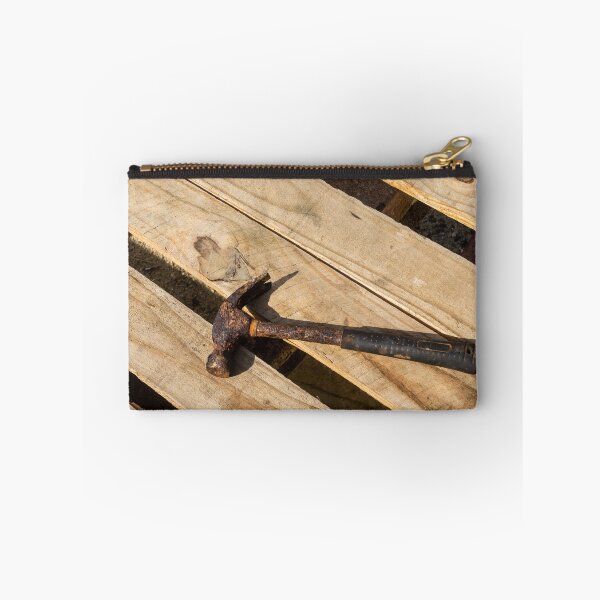 Item preview, Rusty Claw Hammer Lying On Wooden Pallet With Weathered Handle And Sunlit Texture designed and sold by Nmallia.