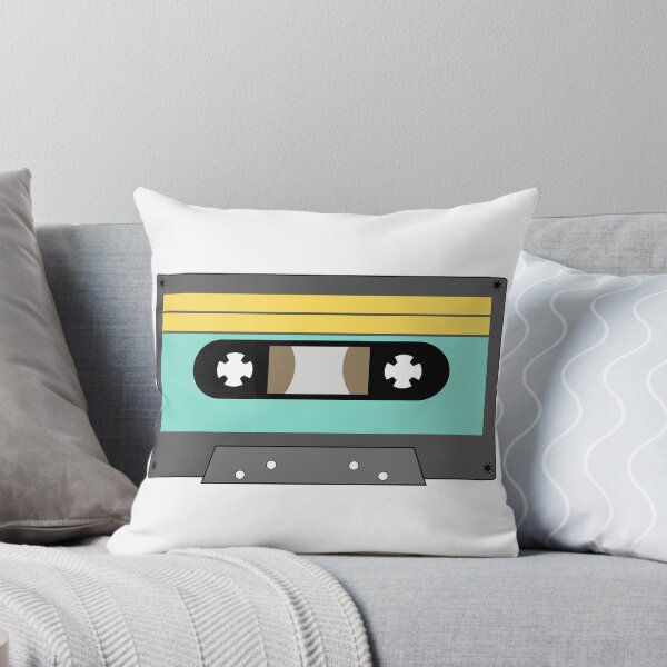 Item preview, La imagen muestra la ilustración de una cinta de casete de audio retro con un cuerpo gris oscuro, una zona de etiqueta azul claro y una franja superior amarilla. designed and sold by Rahman Hafiz.