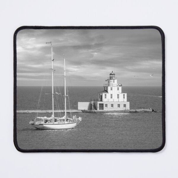 Item preview, Ludington Michigan lighthouse and sailboat in distance black and white designed and sold by TerraMediaLLC.