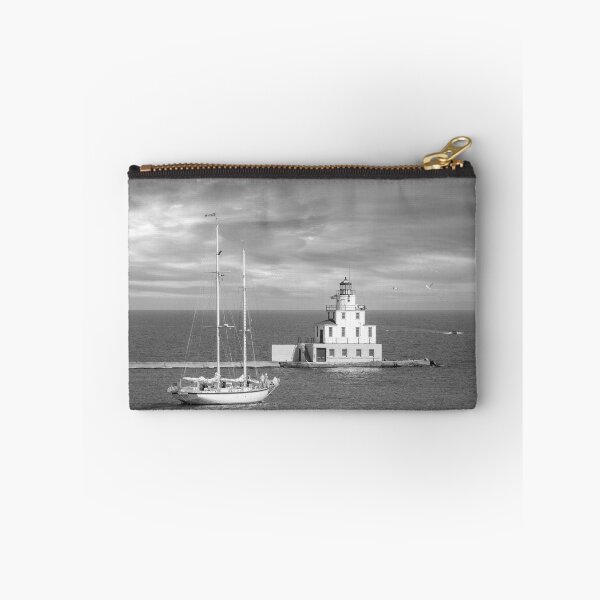 Item preview, Ludington Michigan lighthouse and sailboat in distance black and white designed and sold by TerraMediaLLC.