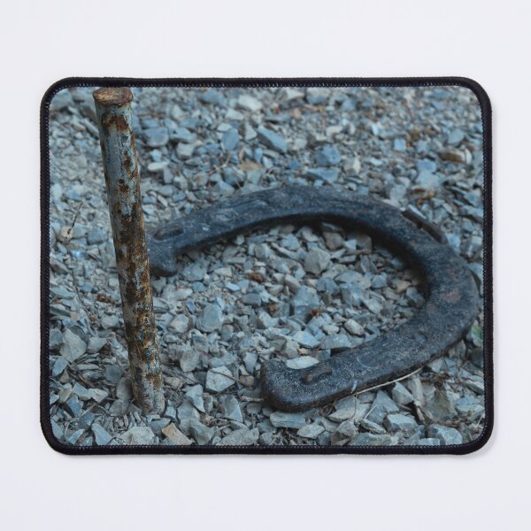 Item preview, Close-up of old horseshoe and rusty peg in gravel designed and sold by lisavonbiela.