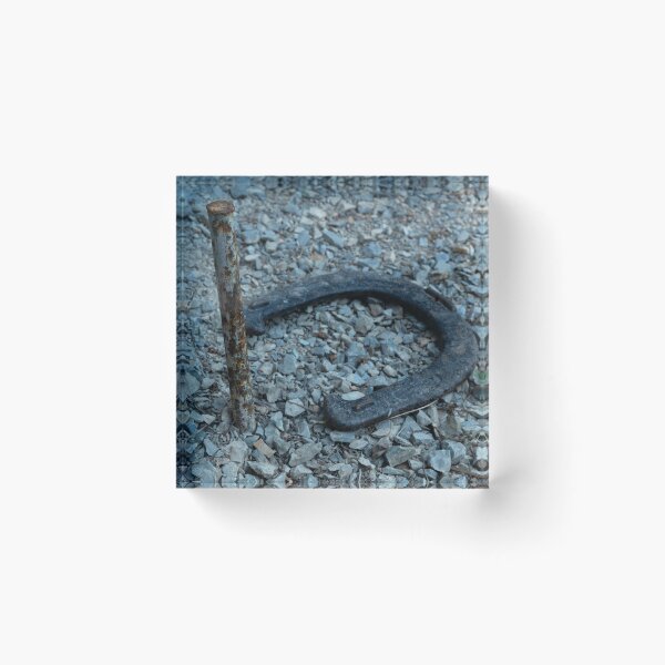 Item preview, Close-up of old horseshoe and rusty peg in gravel designed and sold by lisavonbiela.