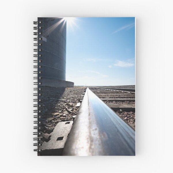 Item preview, Ultrawide and low shot of railroad tracks and grain bin with sunburst designed and sold by lisavonbiela.