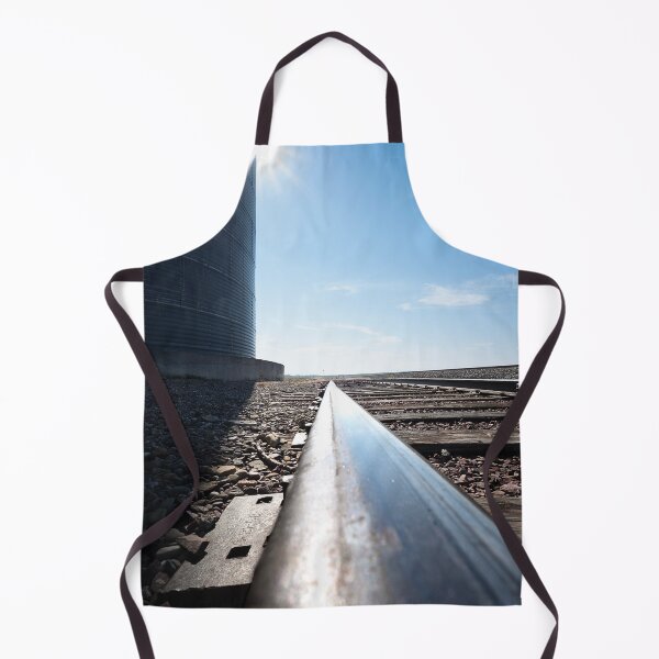 Item preview, Ultrawide and low shot of railroad tracks and grain bin with sunburst designed and sold by lisavonbiela.