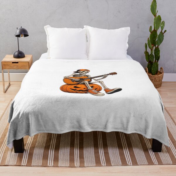 Item preview, Skeleton Sitting on Jack O Lantern Playing the guitar Halloween Cool Graphic designed and sold by OlyvieArt.
