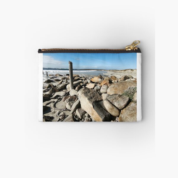 Item preview, Rugged Boulder-Strewn Shoreline With Weathered Post designed and sold by hanlahav.