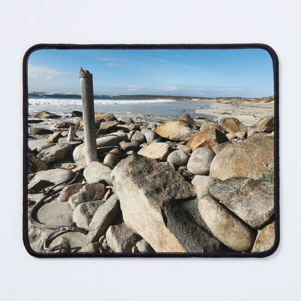 Item preview, Rugged Boulder-Strewn Shoreline With Weathered Post designed and sold by hanlahav.