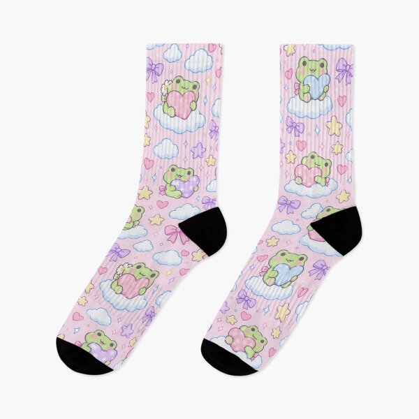 Aperçu de l'œuvre Coussin en forme de cœur avec une grenouille kawaii, motif pastel créée et vendue par Soft Berry Studio.