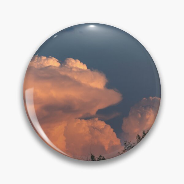 Item preview, Salmon pink cumulonimbus clouds at sunset with trees in foreground designed and sold by lisavonbiela.
