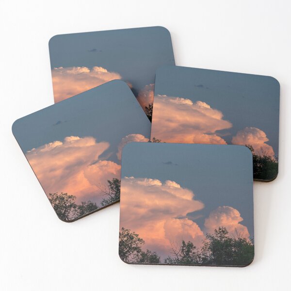 Item preview, Salmon pink cumulonimbus clouds at sunset with trees in foreground designed and sold by lisavonbiela.